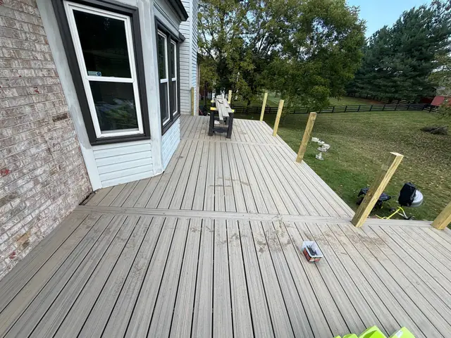 Composite decking divider layout with bare wood railing posts before the railing installation Composite decking divider layout with bare wood railing posts before the railing installation