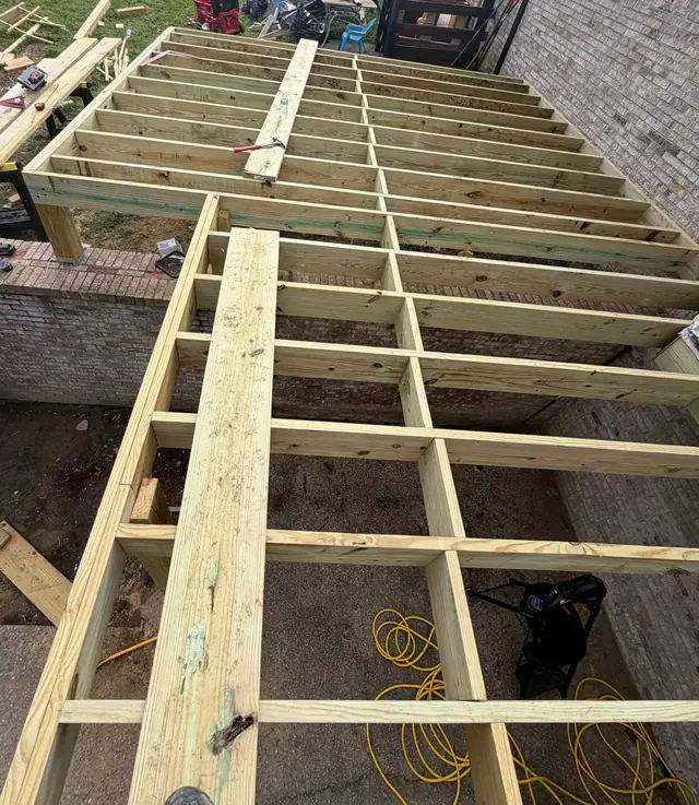 New deck joists and rows of blocking viewed from above before joist tape and decking New deck joists and rows of blocking viewed from above before joist tape and decking