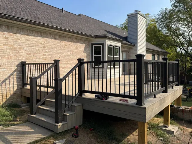 New composite steps, fascia and black railings with tools still on site during final adjustments New composite steps, fascia and black railings with tools still on site during final adjustments