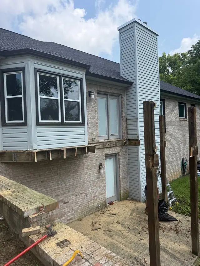 Old deck removed down to remaining posts and wall framing during demolition in Crestwood Old deck removed down to remaining posts and wall framing during demolition in Crestwood