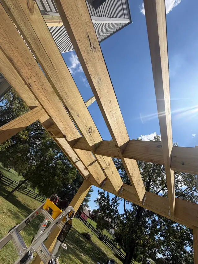 Pressure treated deck joists, blocking and metal connections viewed from below before decking Pressure treated deck joists, blocking and metal connections viewed from below before decking