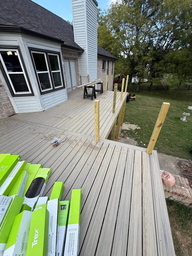 Bare 4x4 railing posts around the new composite decking with Trex railing boxes nearby Bare 4x4 railing posts around the new composite decking with Trex railing boxes nearby