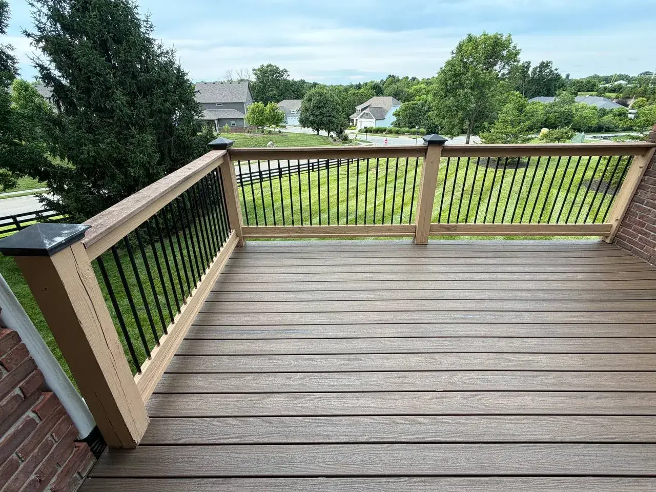 Completed composite deck with black metal balusters