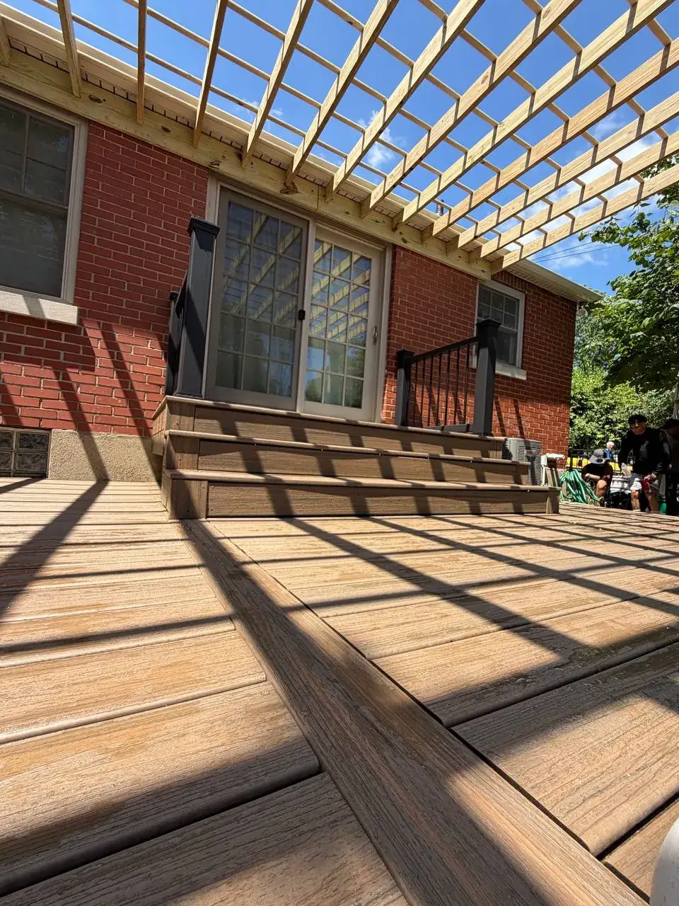 Composite stair transitions beneath a pergola