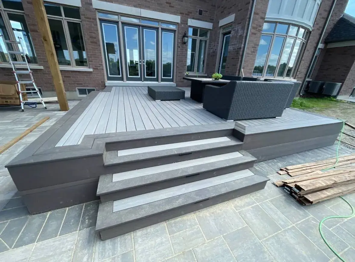 Finished composite patio deck with wide steps
