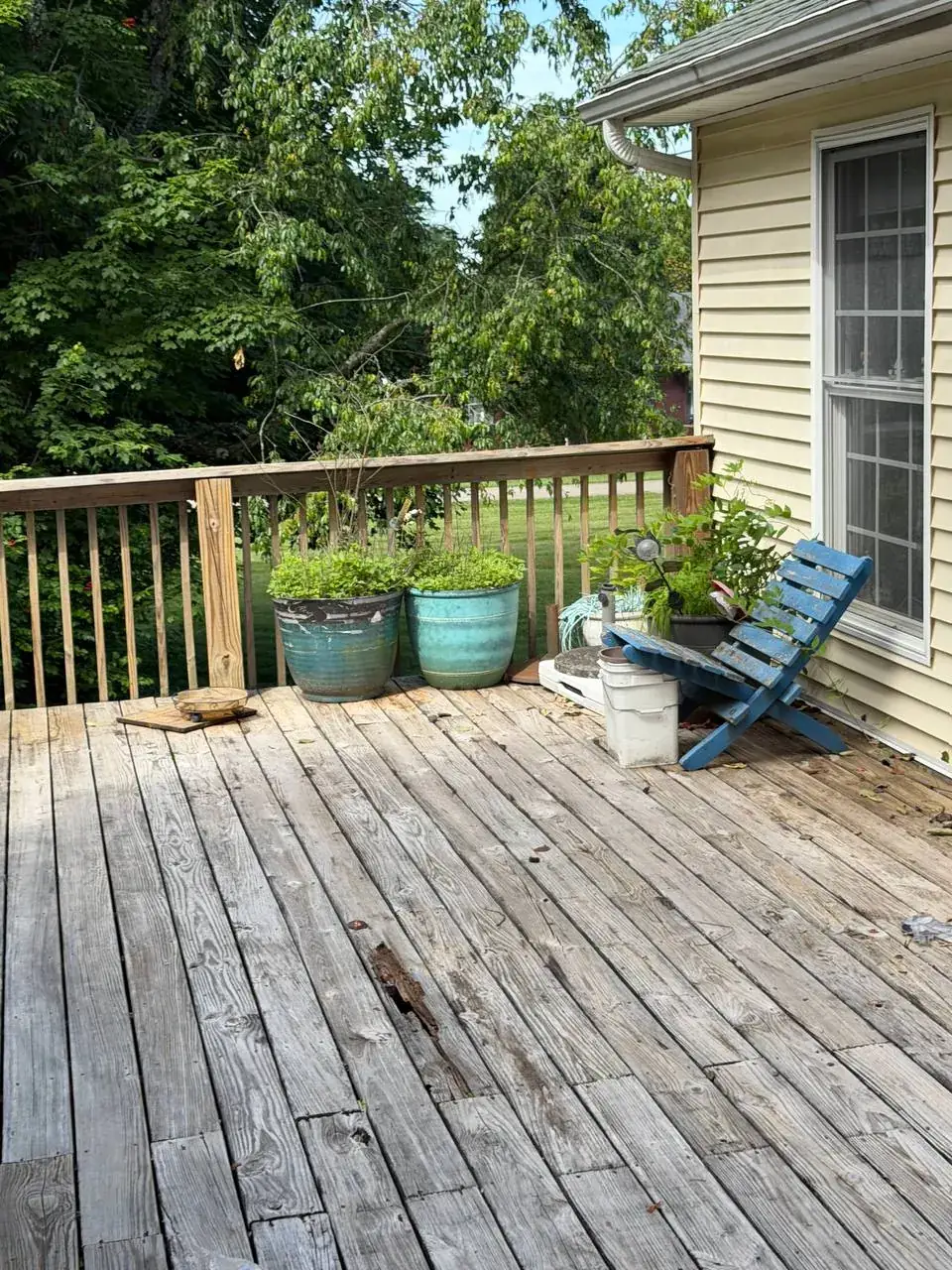 Close view of weathered wood deck boards before resurfacing