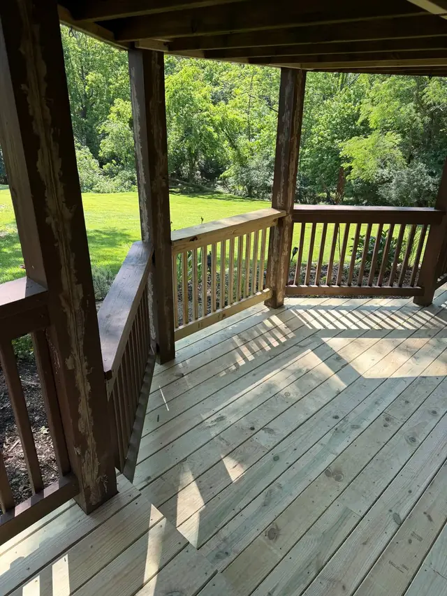 New pressure treated boards and a rebuilt railing section on the covered lower level