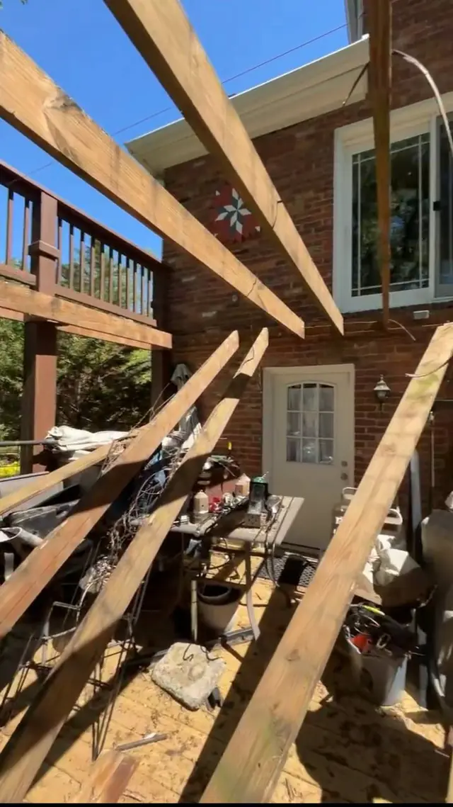 Exposed upper-level joists and removed wood during demolition of the damaged framing