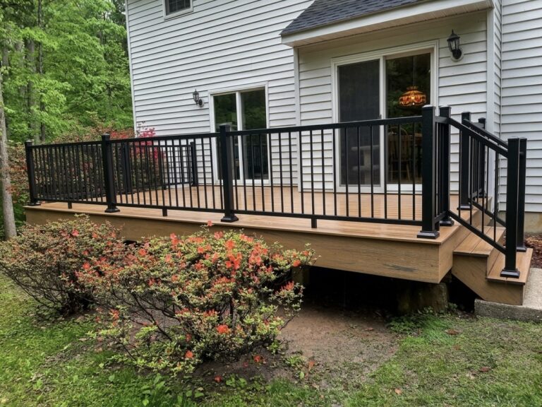 Finished deck stairs and black railings