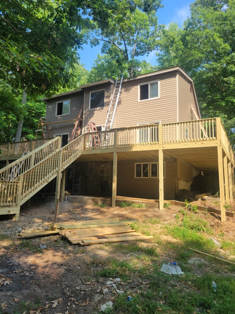 Large wood deck construction project in progress by Javi's Decks